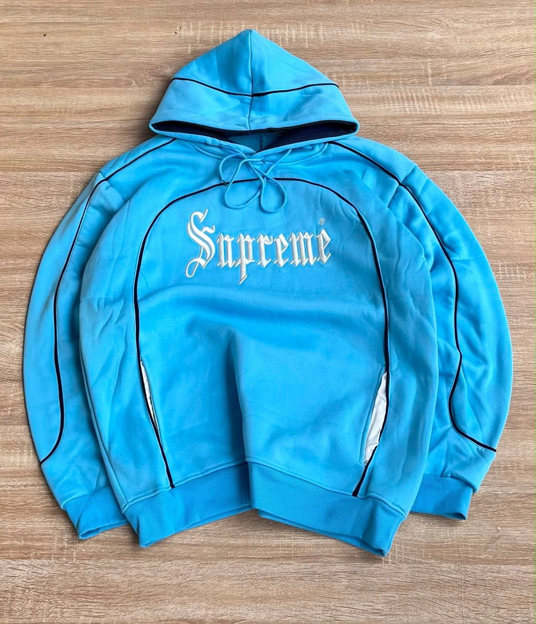 Unisex Supreme Light Blue Hoodie with Script Logo & Contrast Piping - Stylish Streetwear Pullover for Everyday Comfort & Trendsetting Looks