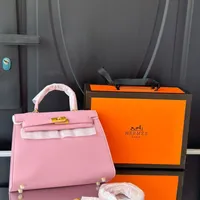 Women's Elegant Pink Structured Top-Handle Handbag with Detachable Shoulder Strap - Luxury Fashion Accessory for Ghanaian Style - View 1