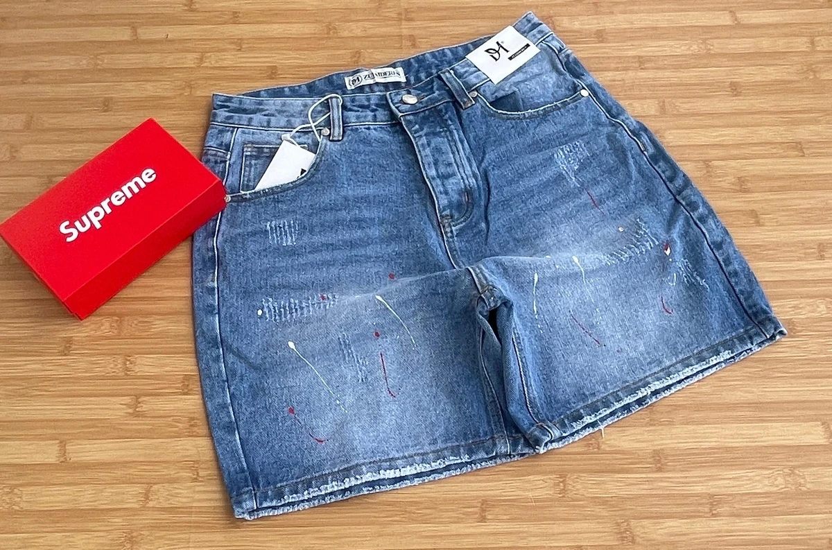 Men's Trendy Distressed Blue Denim Shorts with Artistic Paint Splatter Design - Stylish Casual Streetwear for Modern Youth