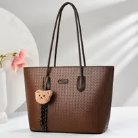 Women's Chic Brown Textured Tote Bag with Adorable Teddy Bear Charm - Fashionable Shoulder Handbag for Everyday Style & Versatility - View 1