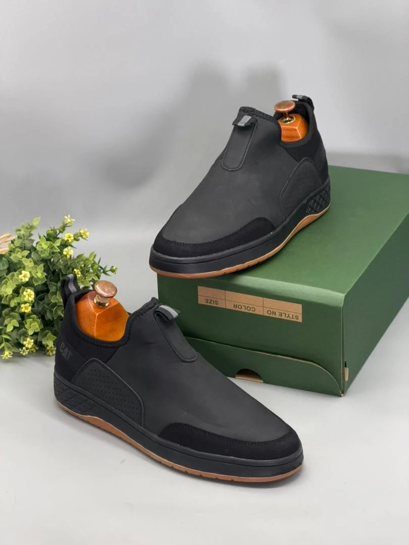 CAT Men's Black Slip-On Casual Shoes with Textured Sides Brown Sole - Everyday - Main View
