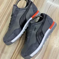 Men's Puma Jogger Trainers Flat Sole Casual Sneakers - Dark Grey and Black Trainers with Suede Red Accents - View 1