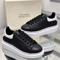 Alexander McQueen Black  White Platform Sneakers - Luxury Lace-up Fashion Trainers with Chunky Sole - View 1