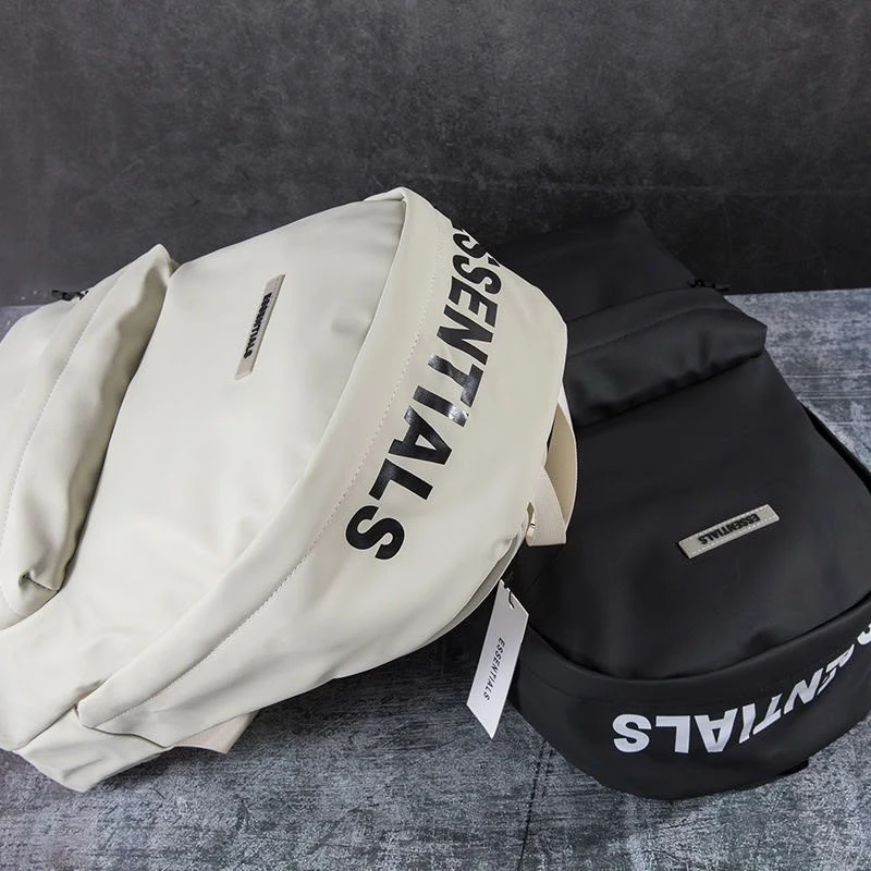 ESSENTIALS Backpack Bag for Everyday, Travel and School – Durable Lightweight Design in Classic Cream and Black Colors