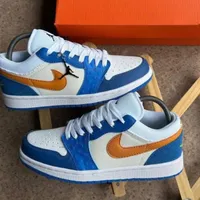 Nike Air Jordan 1 Low Style Sneakers - Vibrant Blue White Textured with Orange Swoosh, Premium Casual Fashion Footwear for Men and Women Trainers - View 2