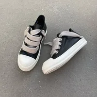 Rick Owens DRKSHDW Black and White Leather Low-Top Sneakers with Chunky Jumbo Grey Laces Stylish Fashion Streetwear Shoes - View 1