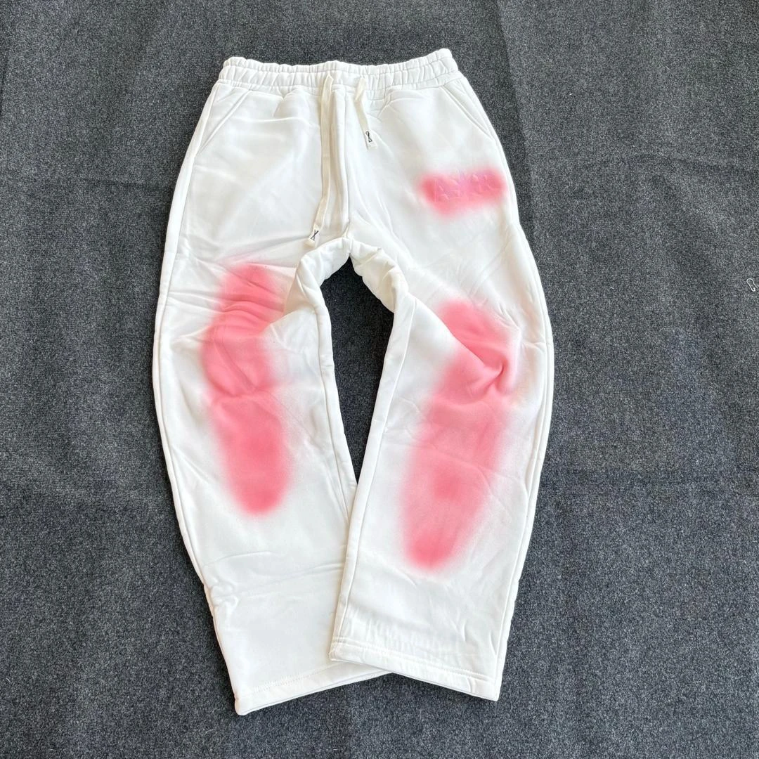 Unisex White & Pink Spray Paint Aesthetic Joggers – Trendy Streetwear Sweatpants with Comfortable Drawstring Waist for Casual Style