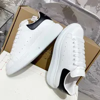 Alexander McQueen White Leather Oversized Sole Sneakers with Black Suede Heel Tab - Unisex Designer Trainers for Men & Women - View 4