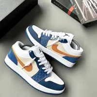 Nike Air Jordan 1 Low Style Sneakers - Vibrant Blue White Textured with Orange Swoosh, Premium Casual Fashion Footwear for Men and Women Trainers - View 1