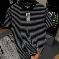 Men's Trendy Black & White Horizontal Striped Polo Shirt - Premium Casual Fashion Tee for Everyday Style - View 1