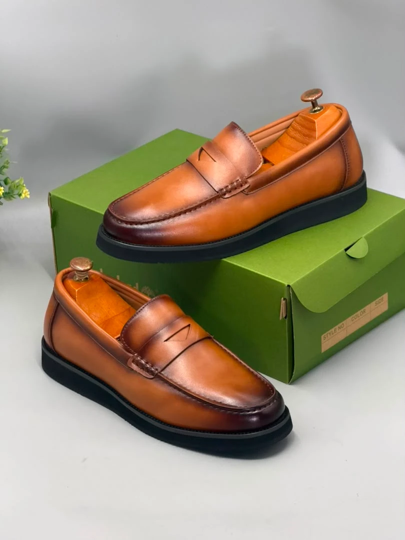 Berluti Men's Premium Tan Burnished Leather Penny Loafers Elegant Slip-On Dress and Casual Shoes with Black Sole for Modern Ghanaian Gentlemen - Versatile Footwear - Main View