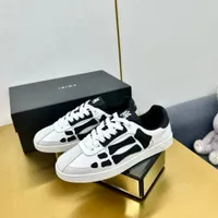 Original Amiri Skeleton Bone Low-Top Sneakers - Stylish Black and White Streetwear Shoes for Men - View 1