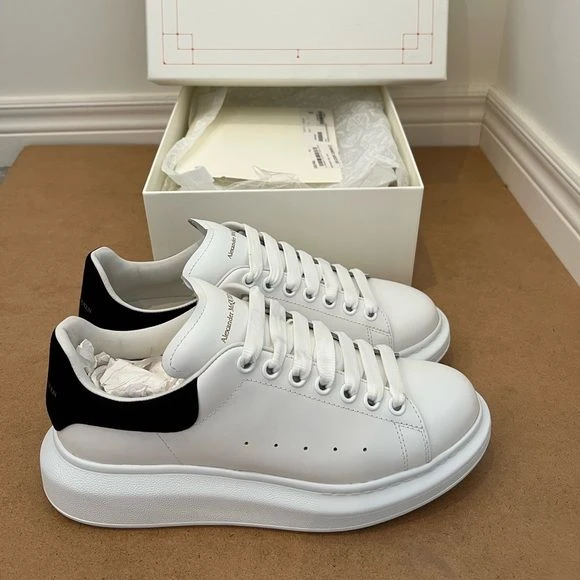 Alexander McQueen White Leather Oversized Sole Sneakers with Black Suede Heel Tab - Unisex Designer Trainers for Men & Women