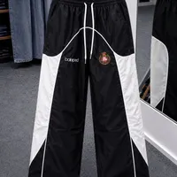 Men’s Balaped Black White Relaxed Fit Drawstring Track Pants with Crest Logo - Stylish Streetwear Joggers for Comfort - View 1